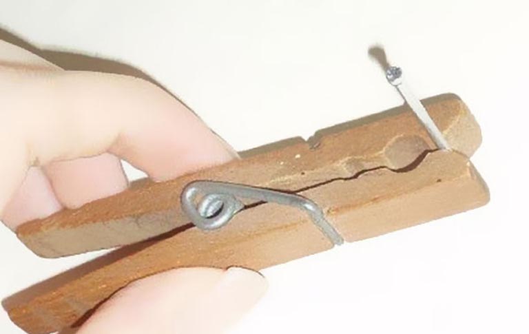 Use A Clothespin To Hold Your Nail In Place